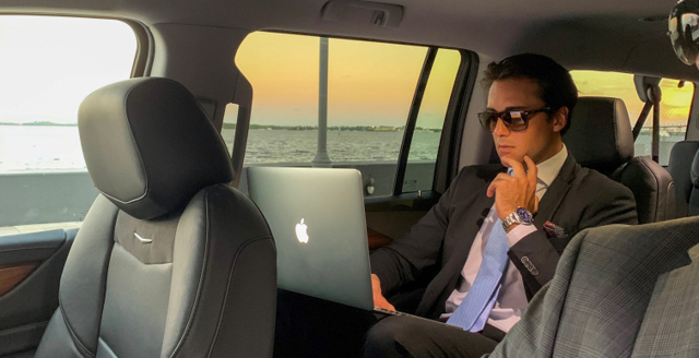 The man enjoying a limo ride